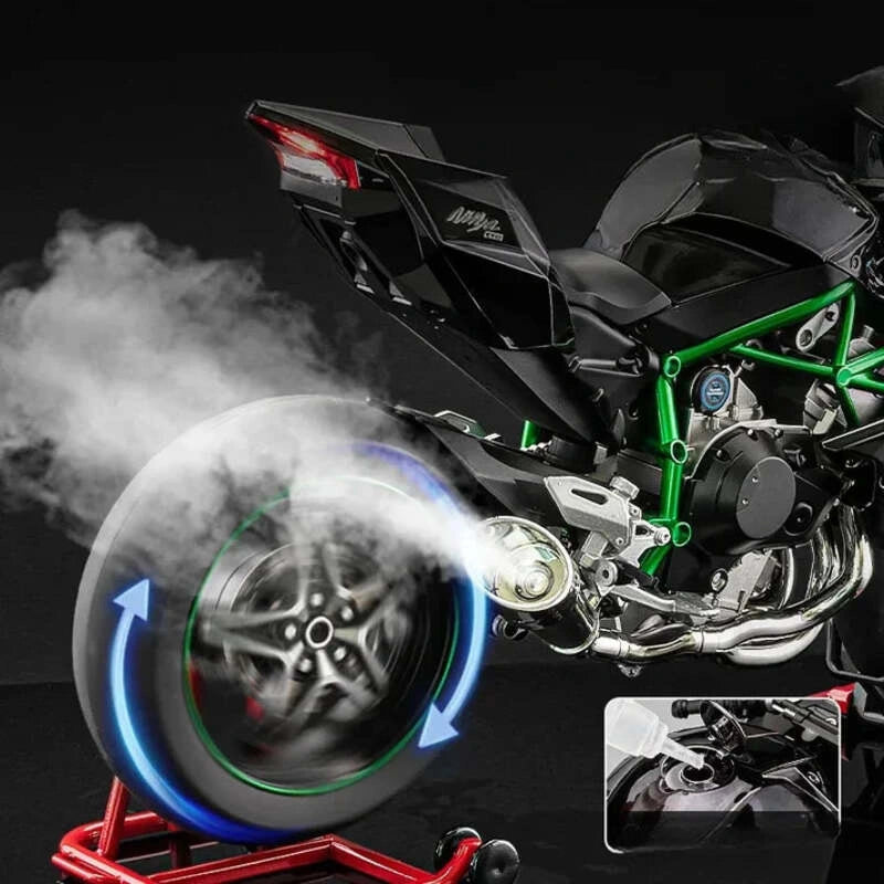 Roue arrière en mouvement avec fumée visible et réservoir d’eau de la Kawasaki H2R miniature.